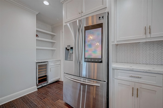 kitchen featuring dark wood-type flooring, white cabinetry, crown molding, stainless steel fridge, and beverage cooler