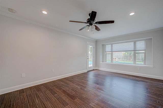 unfurnished room featuring dark wood-type flooring, ornamental molding, and ceiling fan