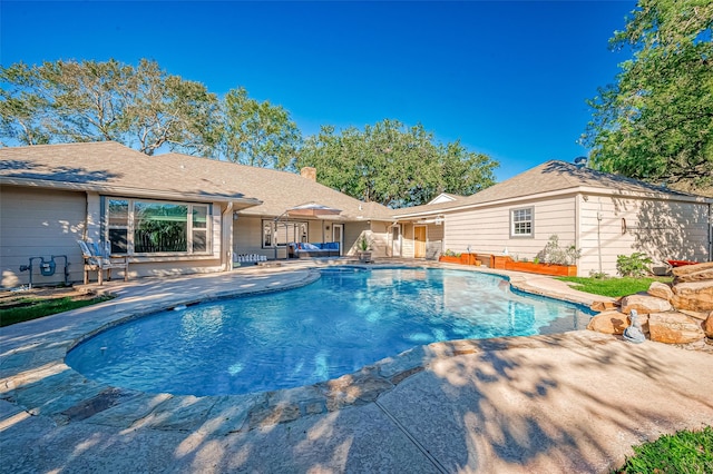 view of pool featuring a patio