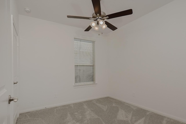 unfurnished room with ceiling fan and light carpet