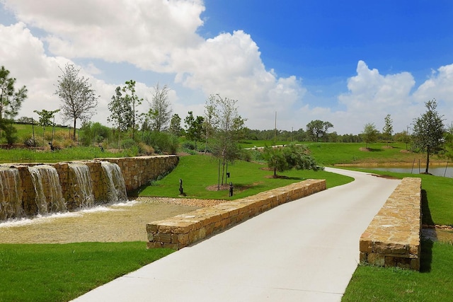 view of home's community featuring a yard