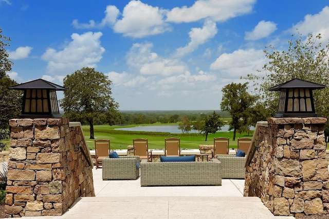 view of patio featuring a water view and outdoor lounge area