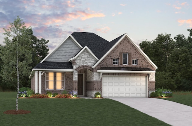 view of front facade with a garage and a lawn