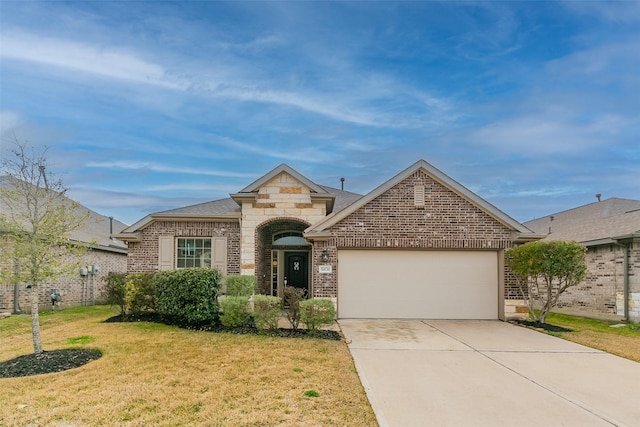 view of front of home featuring a garage and a front yard