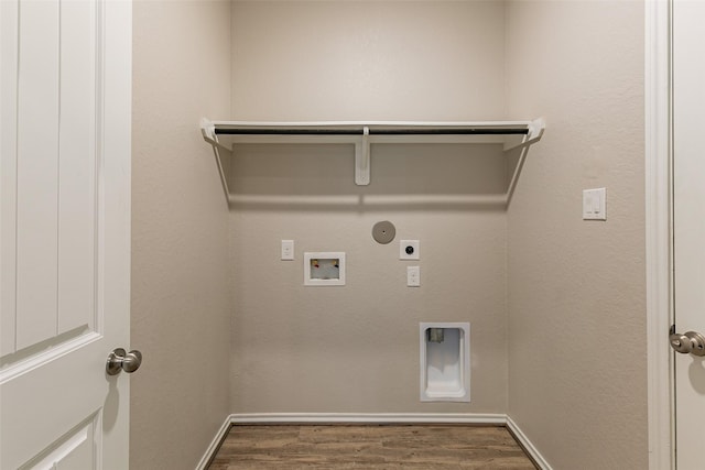 washroom with hookup for a washing machine, electric dryer hookup, dark hardwood / wood-style floors, and hookup for a gas dryer