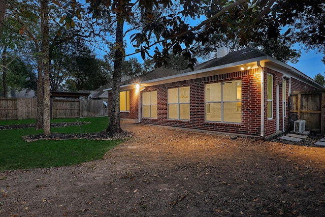 view of property exterior with a lawn