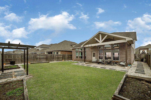 2509 Ocean Key Dr, Texas City, TX 77568 - back of house with a patio, brick siding, and a garden
