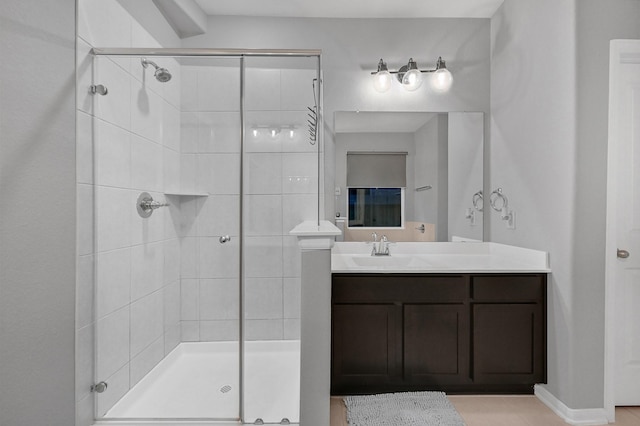 bathroom with vanity and an enclosed shower