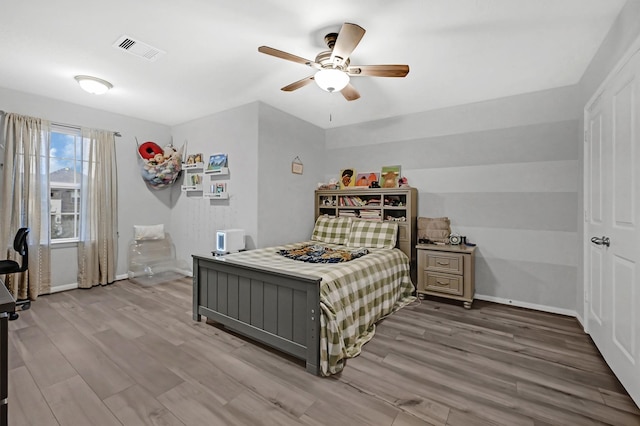 bedroom featuring ceiling fan and light wood-type flooring