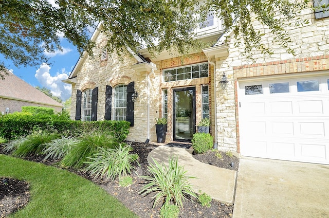 view of exterior entry featuring a garage