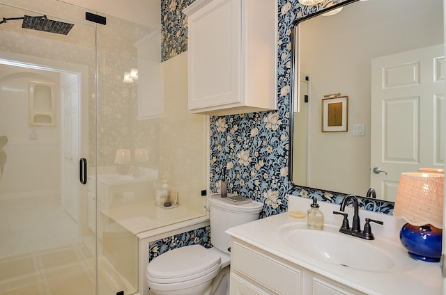 bathroom featuring vanity, an enclosed shower, and toilet