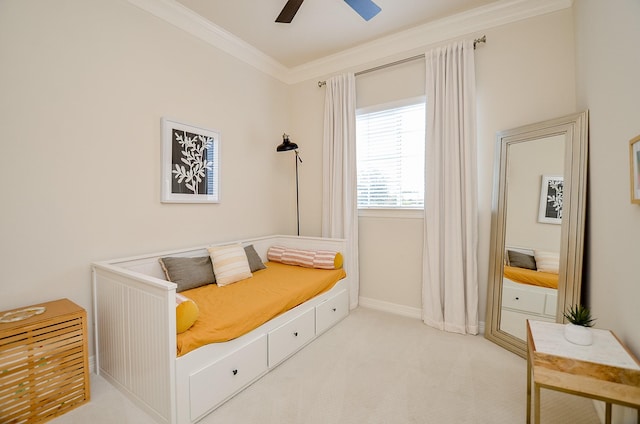 living area featuring light colored carpet, ornamental molding, and ceiling fan