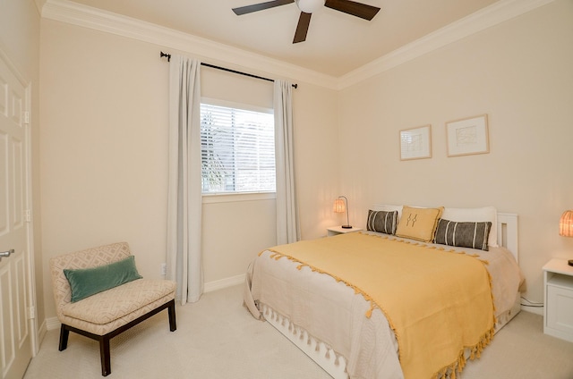 bedroom featuring ornamental molding, light carpet, and ceiling fan