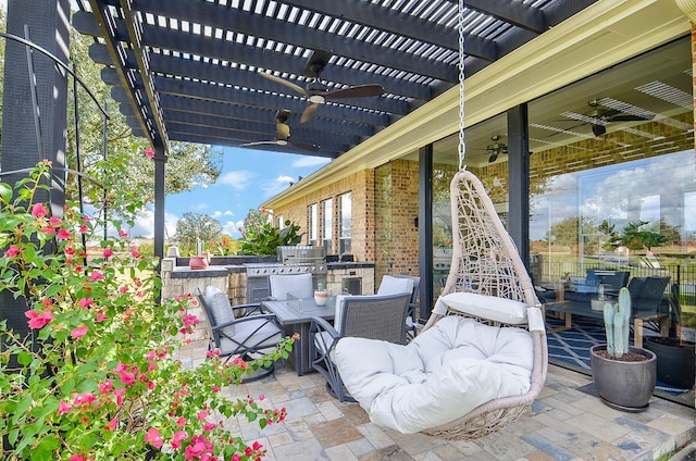 view of patio featuring a pergola and exterior kitchen