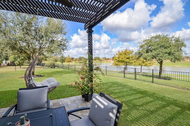 view of yard with a water view, a patio area, and a pergola