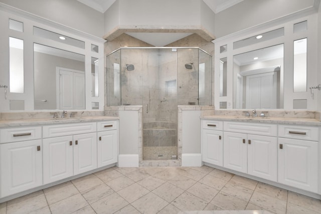 bathroom featuring vanity, crown molding, and a shower with shower door