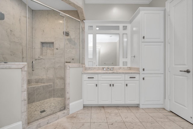 bathroom featuring vanity and a shower with shower door