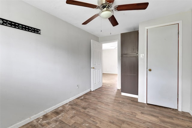 unfurnished bedroom with light hardwood / wood-style floors and ceiling fan