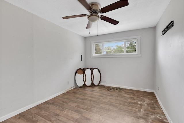 spare room with ceiling fan and hardwood / wood-style floors