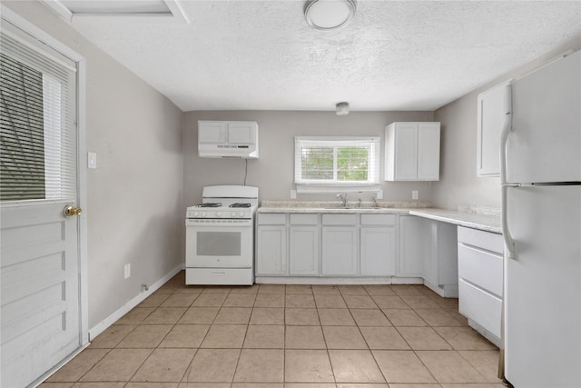 kitchen with light tile patterned flooring, sink, white cabinetry, a textured ceiling, and white appliances