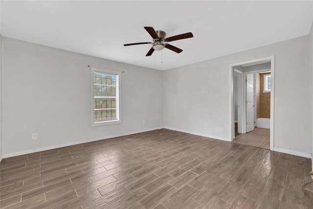 empty room featuring hardwood / wood-style floors and ceiling fan