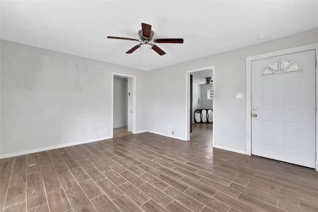 interior space with ceiling fan