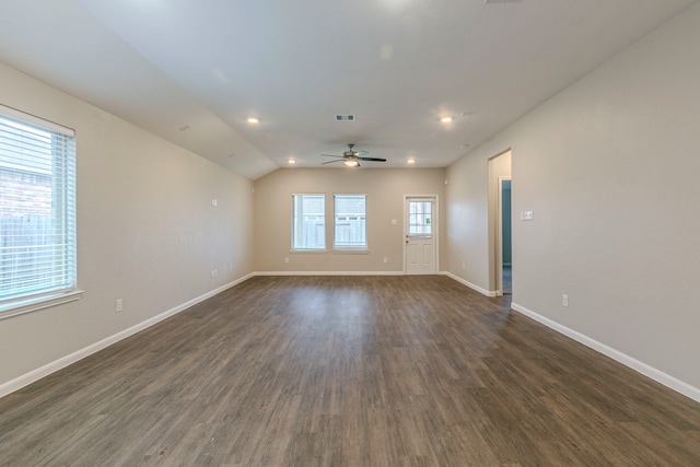 spare room featuring dark wood-type flooring, ceiling fan, and lofted ceiling