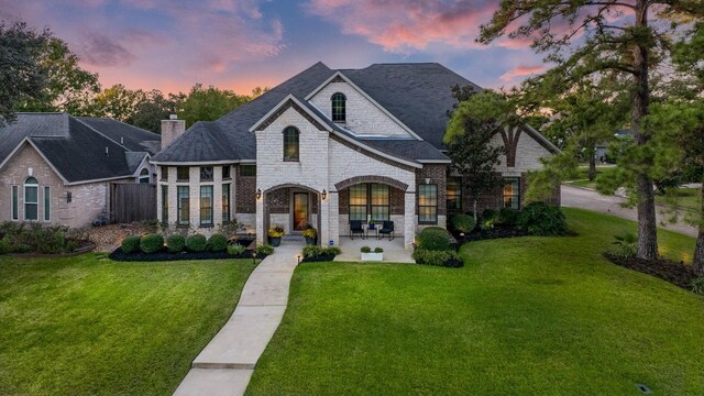 view of front of house with a lawn