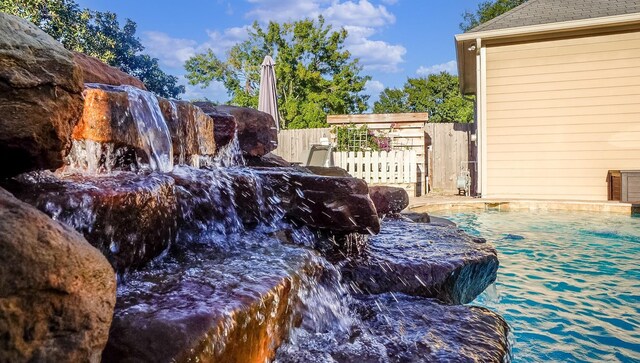 exterior details with a pool