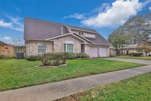 view of front facade featuring a garage, central AC, and a front lawn