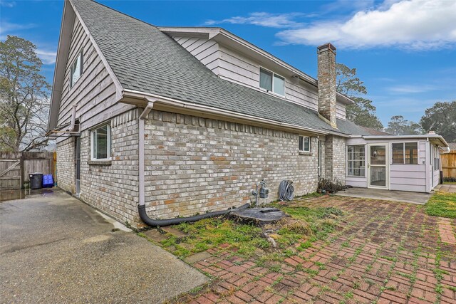 rear view of house featuring a patio