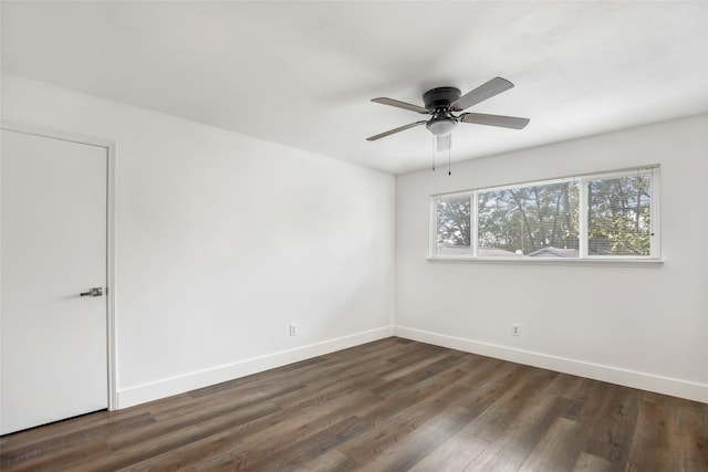 spare room featuring ceiling fan and dark hardwood / wood-style flooring