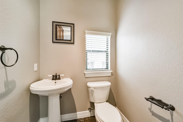 bathroom with sink and toilet