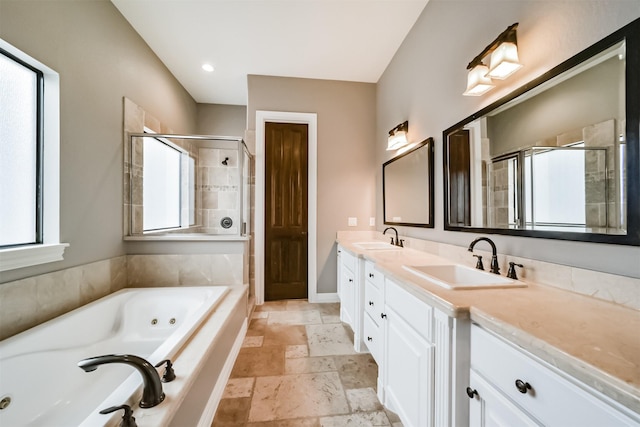 bathroom with independent shower and bath and vanity