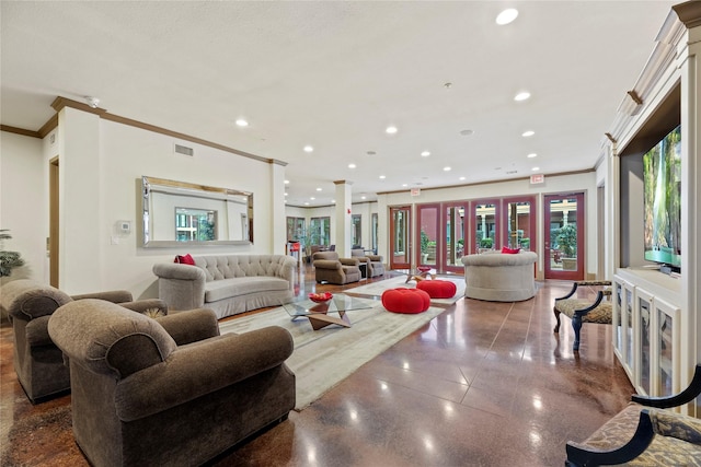 living room featuring crown molding