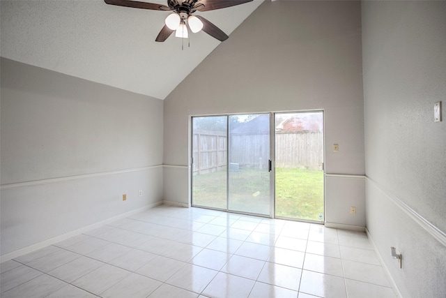 tiled spare room featuring high vaulted ceiling, a healthy amount of sunlight, and ceiling fan