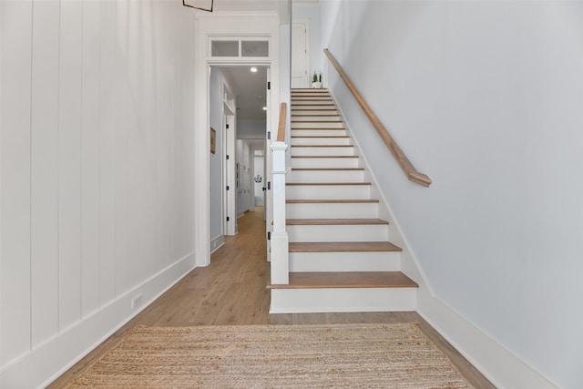 staircase featuring hardwood / wood-style floors