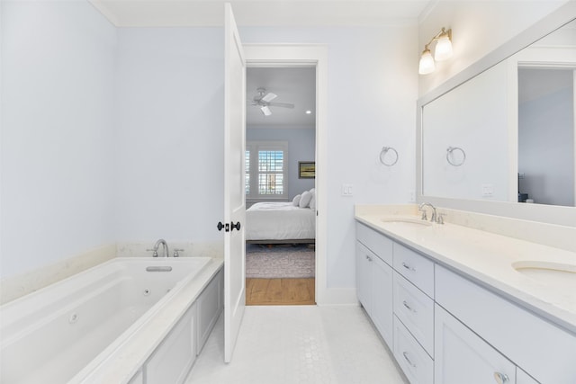 bathroom with crown molding, ceiling fan, vanity, and a bath