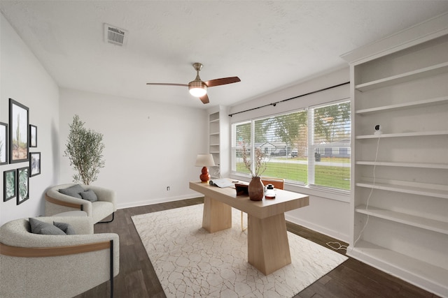 home office featuring ceiling fan and dark hardwood / wood-style flooring