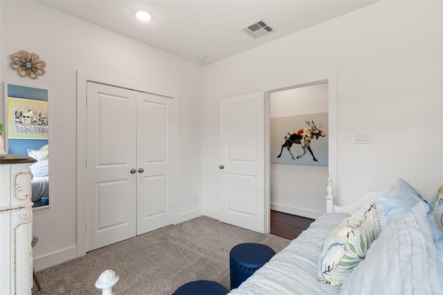 carpeted bedroom featuring a closet