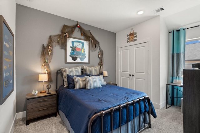 carpeted bedroom featuring a closet