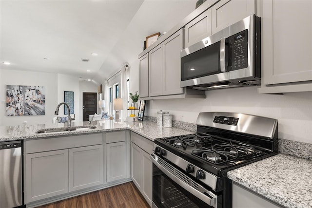 kitchen with stainless steel appliances, sink, and gray cabinets