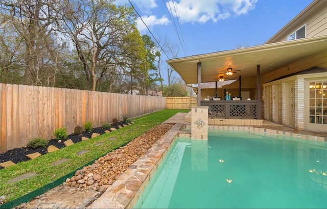 view of pool featuring ceiling fan