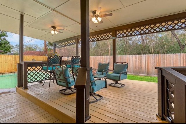 wooden terrace featuring ceiling fan