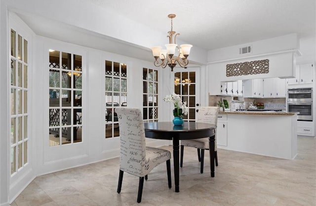 dining room with a chandelier