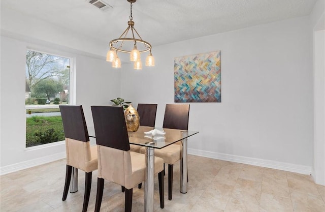 dining room with an inviting chandelier