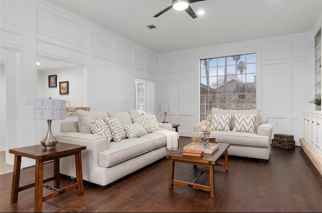 living room featuring ornamental molding, dark hardwood / wood-style floors, and ceiling fan