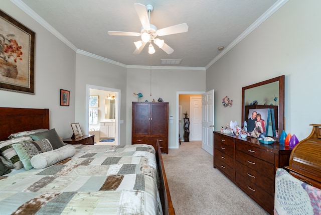 bedroom featuring ornamental molding, connected bathroom, light colored carpet, and ceiling fan