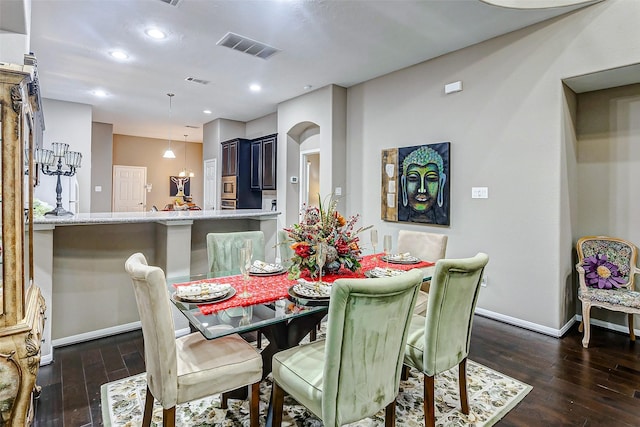 dining room featuring dark hardwood / wood-style flooring