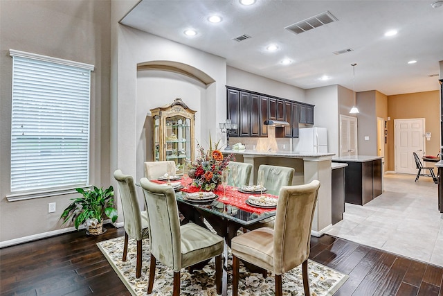 dining area featuring dark hardwood / wood-style flooring